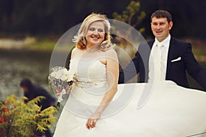 Bride whirls standing behind a groom