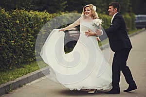 Bride whirls standing behind a groom