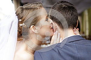 Bride is whispering I love you into his groom ear