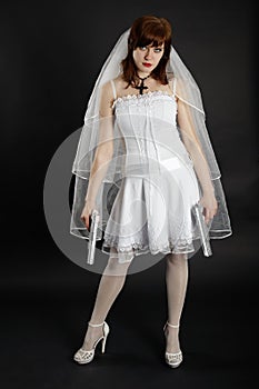 Bride in white dress armed with two pistols