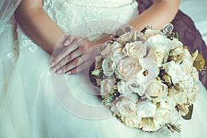 Bride in White Dress Holding Splendid Bridal Boquet
