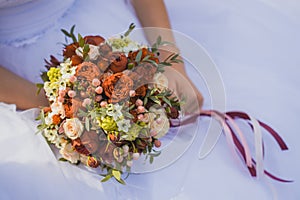 Bride in White Dress Holding Splendid Bridal Boquet