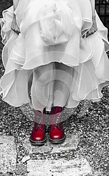 Bride in white dress and red amphibians