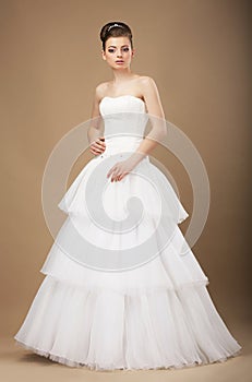 Bride in White Long Dress Posing in Studio