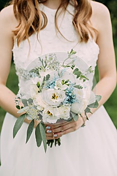 bride white wedding dress flowers hands conceptual