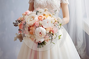 Bride in white wedding dress holding bridal bouquet