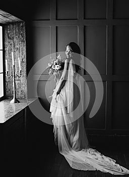 Bride white wedding dress window flowers hands