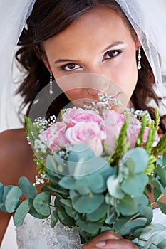 Bride woman, bouquet and portrait at wedding with flowers, pride and commitment at event, celebration and party. Girl