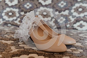 Bride& x27;s accessories. Women& x27;s shoes leather, garter, bridal bouquet, candles, pendant