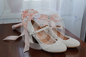 Bride& x27;s accessories. Women& x27;s shoes leather, garter, bridal bouquet, candles, pendant