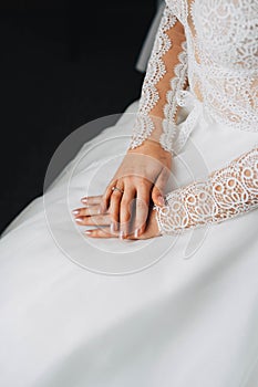 The bride hands. Wedding ring on the finger.