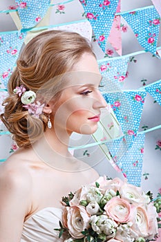 Bride.Young fashion model with make up, ,curly hair, flowers in hair. Bride fashion. Jewelry and Beauty. Woman in white dress