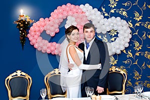 Bridegroom and bride at banquet