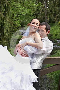 Bridegroom and bride on the wedding in park