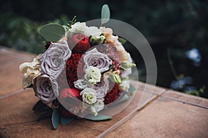 Brides bouquet with red roses