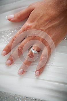 Brides hand with engagement ring