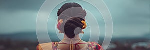 Bridal Hairstyle Adorned With Sindoor Against a Soft Sky Backdrop at a Wedding Celebration photo
