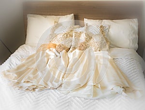 Brides maids dresses on bed photo