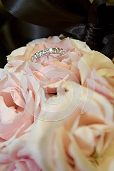 Brides ring in her bridal bouquet