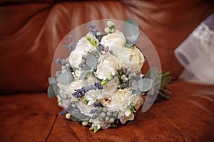 Brides wedding bouquet with wedding rings