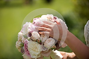 Brides wedding ring with bouquet