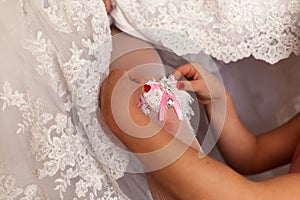 The bridesmaid helps to bride