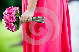 Bridesmaid holding a bouquet of flowers