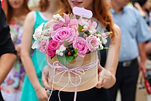 Bridesmaid holding bridal bouquet