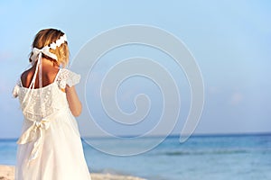 Bridesmaid Standing On Beach At Wedding Ceremony