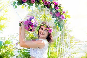 Bridesmaid with a wedding bouquet. Arch for weddin