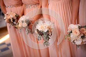 Bridesmaids holding beautiful bridal bouquets