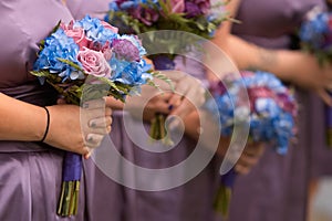Bridesmaids holding bouquets photo