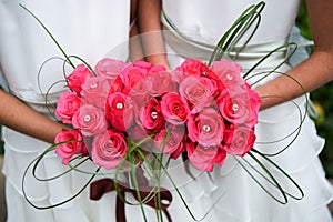 Bridesmaids with vibrant pink bouquets