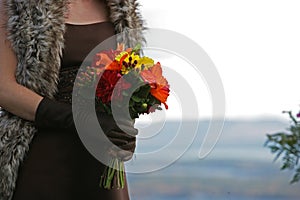 Bridesmate holding a beautiful flower bouquet