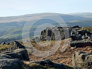 Bridestones moor in west yorkshire with gritstone outcrops surrounded by hills on a sunny day photo