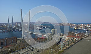 The bridge across the Bay, in the port city. sunny day and flourishing greenery