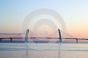 Bridge across the Bay, suspension bridge, bridge and evening sunset, urban landscape