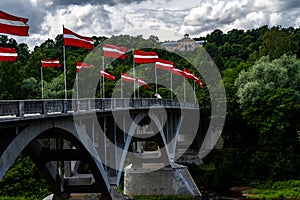 The bridge across the Gauja river decorated with the national flags of Latvia.Sigulda city .Latvia