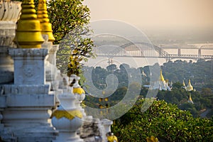 The bridge across Irrawadee river and the old pagodas in Sagaing Area. Mandalay. Myanmar photo