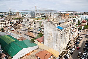 The bridge across the Maputo Bay from Maputo to Katembe, seen over high-rise buildings and streets of Maputo city centre.