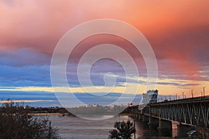 Bridge across river Dnieper at sunset