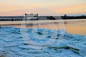 Bridge across river Dnieper at sunset