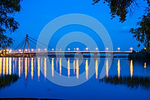 Bridge across the wide river Dnieper at night.