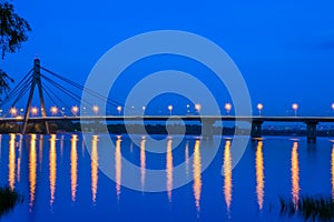 Bridge across the wide river Dnieper at night.