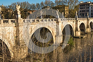 Bridge of Angels straddling the Tiber River in Rome, Italy photo