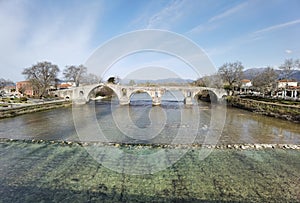 Bridge arched in arta city on arahthos river in greece photo