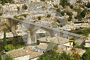 A bridge over the river ArdÃ¨che in France photo