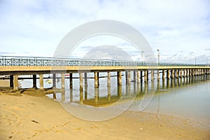 Bridge of the beach of Faro in winter. Algarve region, Portugal