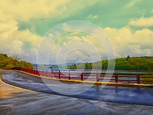 Bridge on the bend of an asphalt road