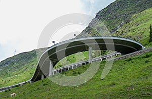 A bridge, a bend, and a gallery on Gotthard motorway pass street, Switzerland